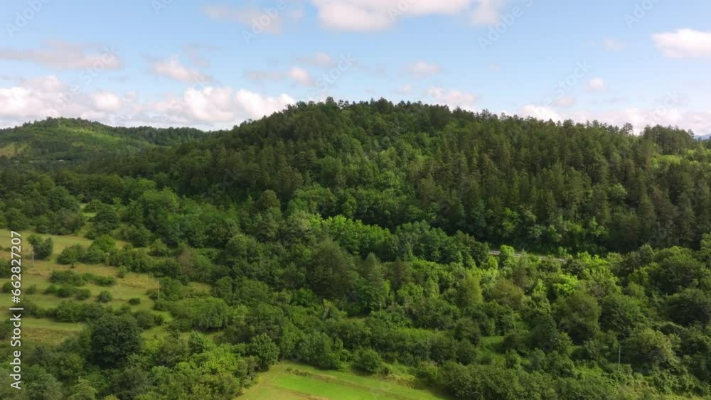 Aerial flight over the landscape of Slovenia with hills, forests and grassland. Aerial flight over the landscape of Slovenia with hills, forests and grassland.