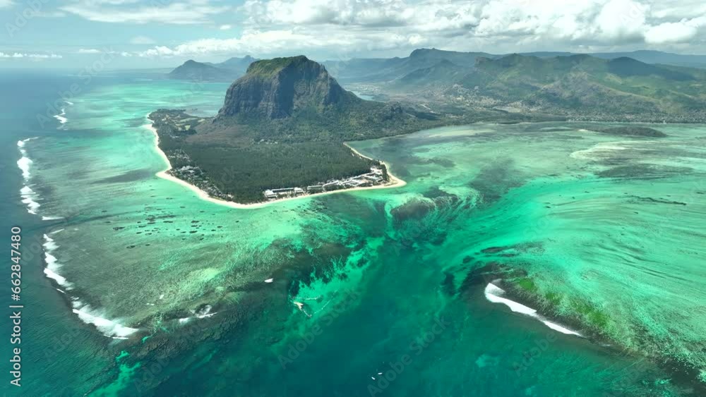 Aerial view of Mauritius island and Le Morne Brabant mountain with beautiful lagoon and underwater waterfall illusion