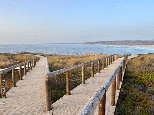 Boardwalk to the ocean beach, ocean view © Oksana