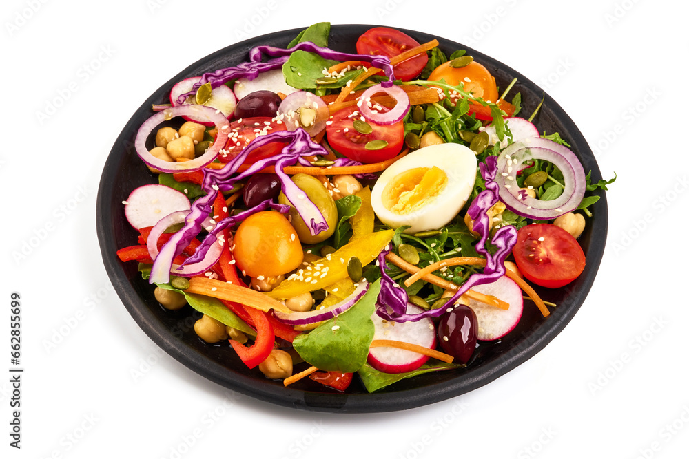 Salad with carrot, red cabbage, eggs, olives and fresh vegetables, isolated on white background. High resolution image.