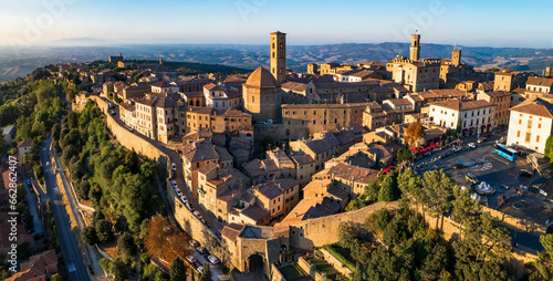 Fototapeta Naklejka Na Ścianę i Meble -  Italy. Volterra - scenic medieval town of Tuscany, Italian famous landmarks and heritage site. aerial drone panorama over sunset.