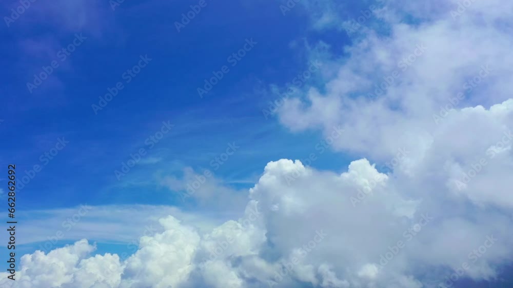 .Natural daylight and white clouds floating on blue sky..aerial panorama view white clouds in the blue sky background..light through the large white clouds float in the blue sky .Natural daylight and white clouds floating on blue sky..aerial panorama view white clouds in the blue sky background..light through the large white clouds float in the blue sky