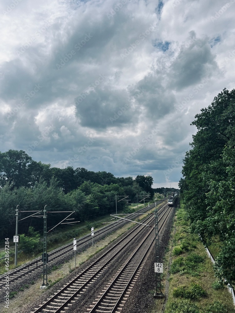 Fototapeta premium Empty railways in countryside, cloudy sky
