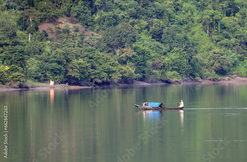 Fototapeta Naklejka Na Ścianę i Meble -   fishing boat on kaptai lake.this photo was taken from kaptai,Bangladesh.