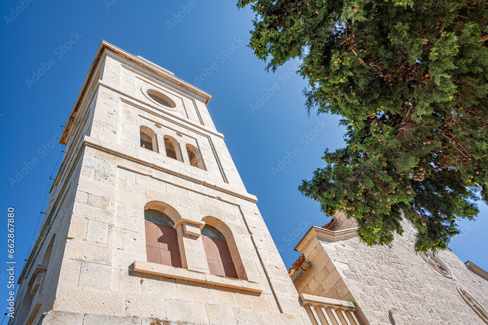 St. George's Church made of white limestone in Primosten, Croatia.