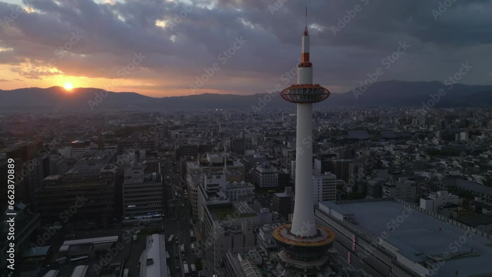 flying counter clockwise around Kyoto Tower at sunset flying counter clockwise around Kyoto Tower at sunset