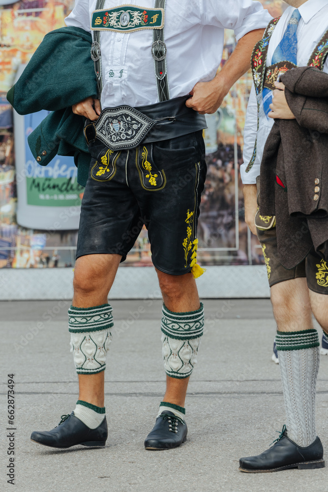 Man wearing the traditional Bavarian Lederhosen at the Oktoberfest in Munich close-up Man wearing the traditional Bavarian Lederhosen at the Oktoberfest in Munich close-up