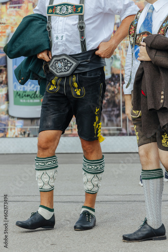 Man wearing the traditional Bavarian Lederhosen at the Oktoberfest in Munich close-up