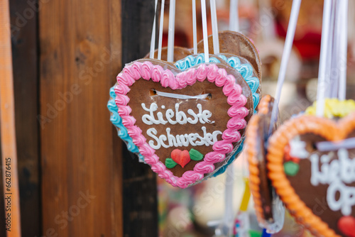 Traditional Lebkuchenherz Gingerbread heart at the famous Oktoberfest in Munich, reading "dearest sister"