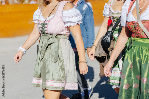 Woman wearing the traditional Bavarian dress Dirndl at the Oktoberfest in Munich, Germany