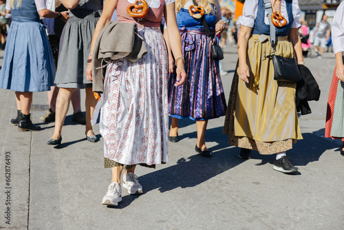 Woman wearing the traditional Bavarian dress Dirndl at the Oktoberfest in Munich, Germany