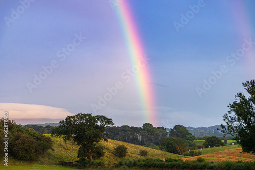 A strong summer rainbow at Irthington, Cumbria, England UK