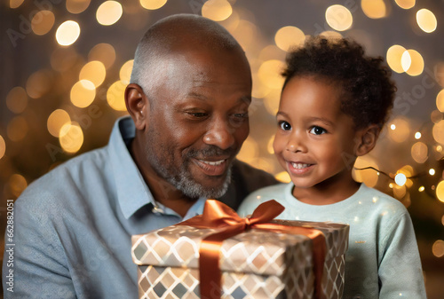 boy with his grandfather, about to give a Christmas present
