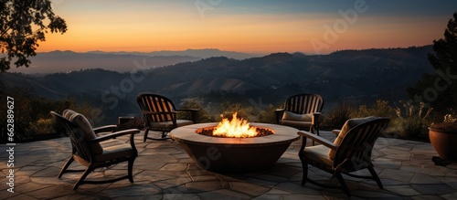 California home terrace with chairs surrounding a fiery pit With copyspace for text