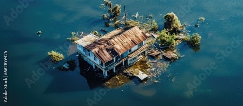 Bird s eye perspective of submerged residence surrounded by murky water With copyspace for text photo