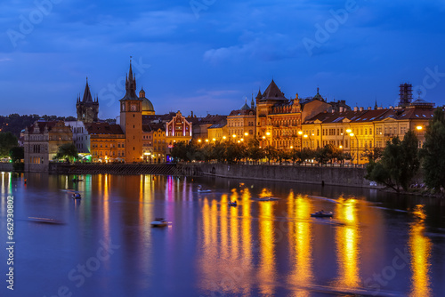 Prague medieval architecture and Vltava river at night, Czech Republic.
