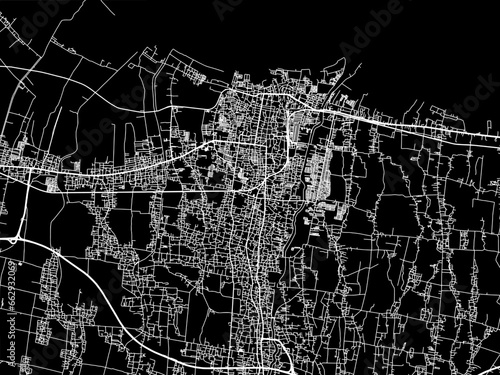 Vector road map of the city of  Tegal in Indonesia with white roads on a black background. photo