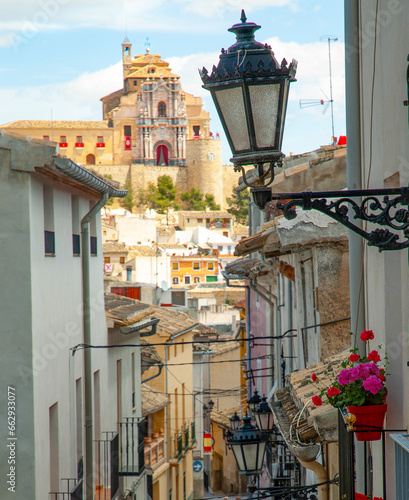 View of the monastery of San Clara in the city of Caravaca de la Cruz Murcia, through the streets decorated with flowers photo