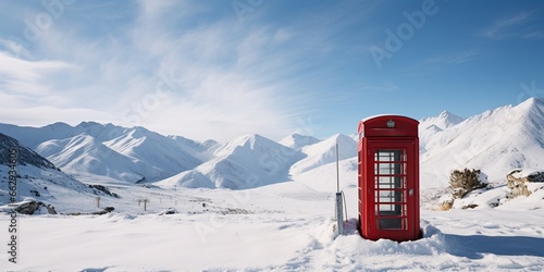 On a remote, snowy peak, a telephone booth stands , concept of Isolation © koldunova
