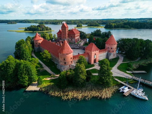 Aerial view of the historic Trakai Castle surrounded by water in Lithuania photo