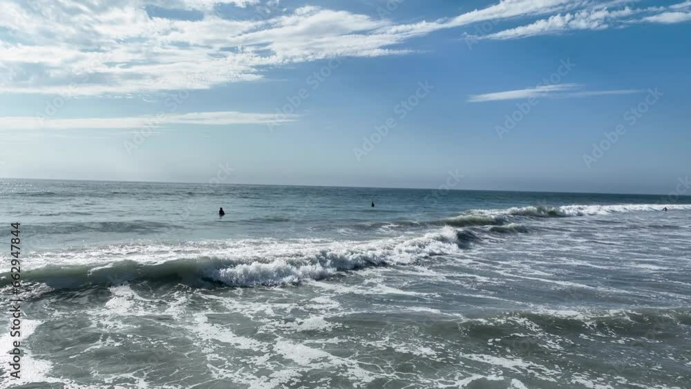 Aerial view of surfers enjoying nice waves in Del Mar Beach, California, USA. Aerial view of surfers enjoying nice waves in Del Mar Beach, California, USA.