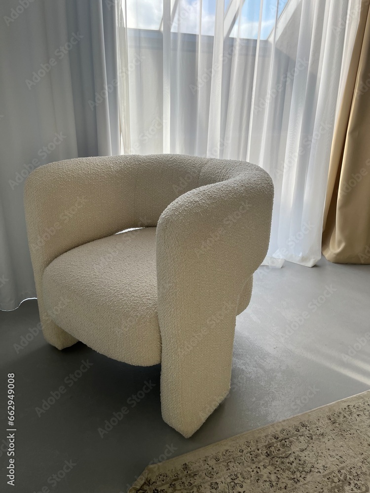 Beautiful white armchair in the interior Beautiful white armchair in the interior