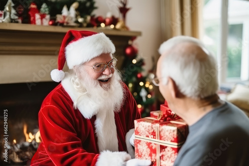 Seniors celebrating Christmas. Santa Claus giving present gifts to elderly people in nursing home, retirement home, senior community