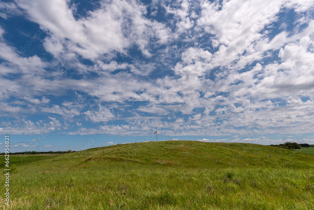 The American flag on the hill with white clouds and blue skies at Fort Juelson historical site just outside of Underwood, Minnesota United States.
The American flag on the hill with white clouds and blue skies at Fort Juelson historical site just outside of Underwood, Minnesota United States.