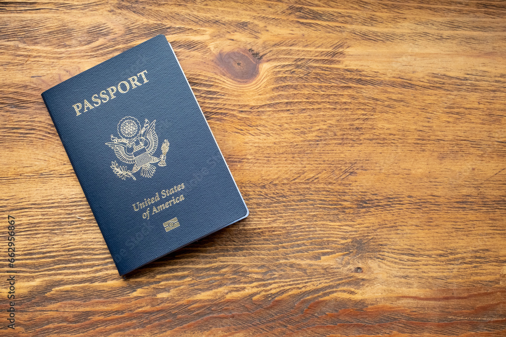 Passport on wooden table background - obrazy, fototapety, plakaty 