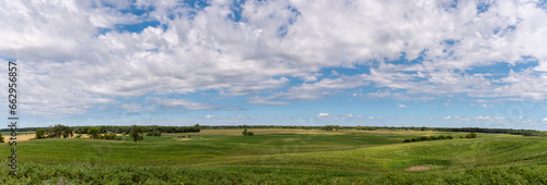 Panoramic view of the fertile countryside with different crops in the fields of rural west central Minnesota, United States. 