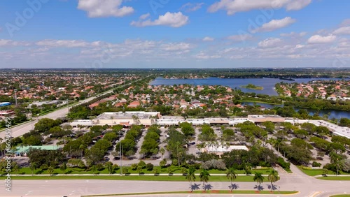 Aerial rising reveal Silver Lakes Florida Publix Supermarket shopping plaza photo