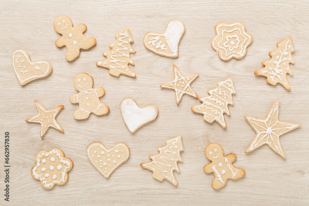 Cute homemade Christmas cookies on wooden background,top view