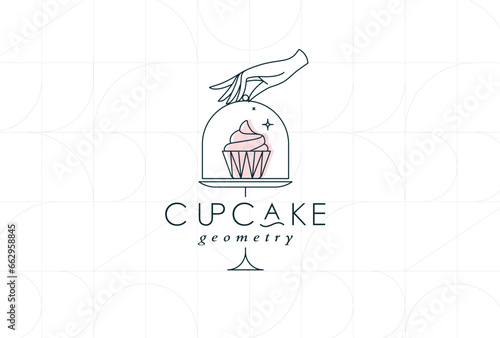 Cake stand with cupcake in art deco style holding by hand drawing on white background