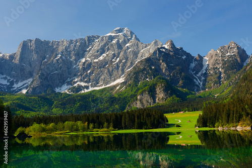 Incredible view of Fusine lake in summer. Popular travel destination of Julian Alps. Location: Tarvisio comune , Province of Udine, Italy, Europe