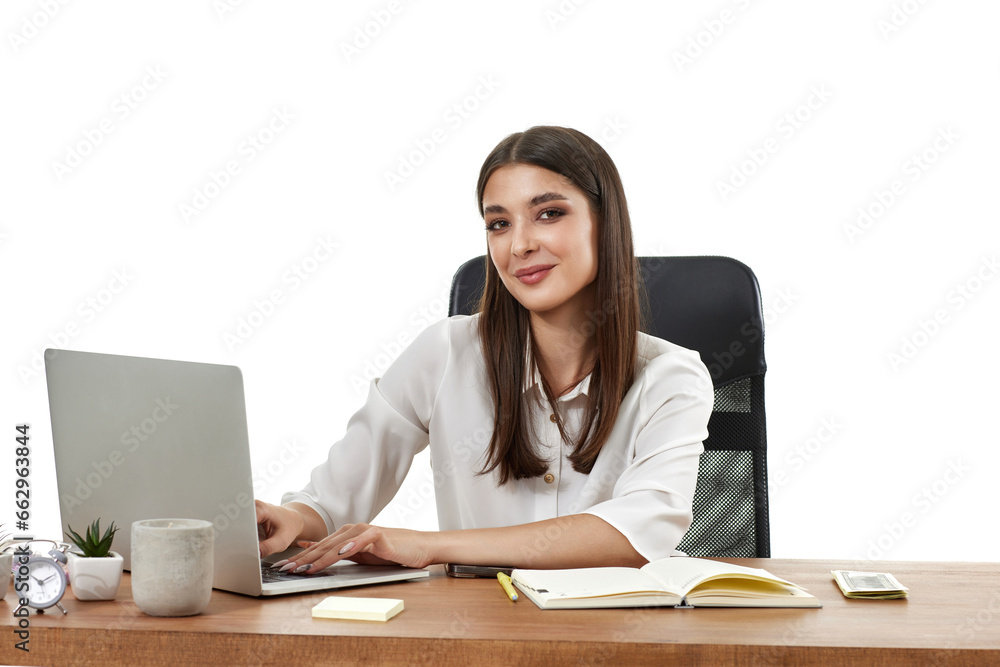 young businesswoman sitting on chair at table and using laptop young businesswoman sitting on chair at table and using laptop
