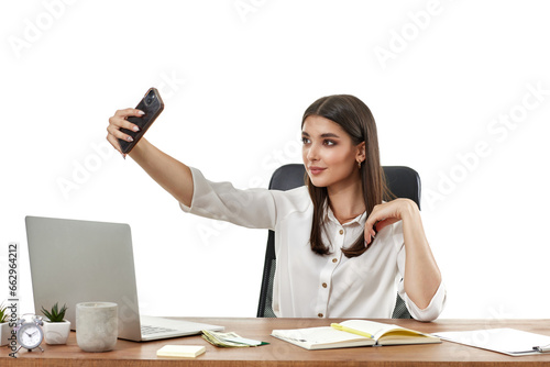happy beautiful woman takes selfie in office