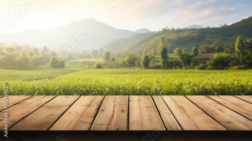 Empty wood table and blurred rice field and mountain landscape at morning Empty wooden table with rice field and sunshine for display or montage your products. Generative AI