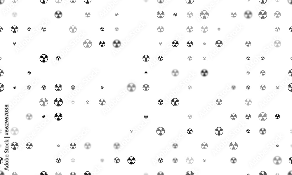 Seamless background pattern of evenly spaced black radiation symbols of different sizes and opacity. Illustration on transparent background