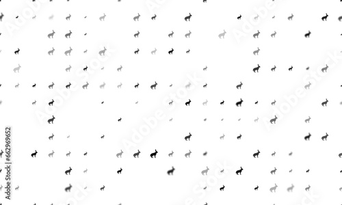 Seamless background pattern of evenly spaced black hare symbols of different sizes and opacity. Vector illustration on white background © Alexey