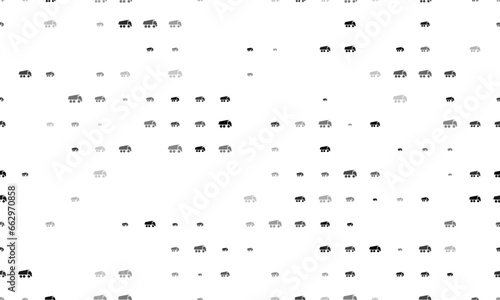 Seamless background pattern of evenly spaced black truck symbols of different sizes and opacity. Vector illustration on white background