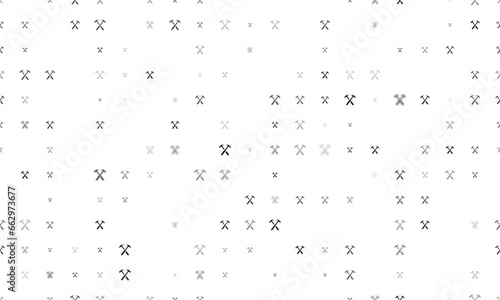 Seamless background pattern of evenly spaced black crossed hammers symbols of different sizes and opacity. Vector illustration on white background