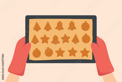 hands holding a baking tray with homemade christmas gingerbread cookies -vector illustration