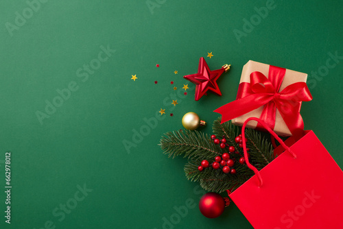 The theme of chic Christmas presents. Top flat lay of fir twig, gift box, red package, сhristmas tree baubles, gold stars confetti on green background with promo area