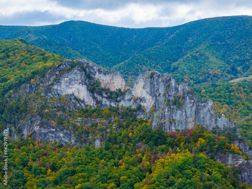 Aerial view of the Seneca Rocks with lush vegetation and clouds