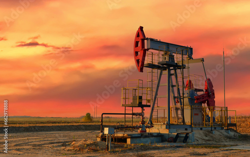 Oil prices on global market. Crude oil Pumpjack on oilfield on sunset. Fossil crude production. Oil drill rig and drilling derrick. Global crude oil Prices, petroleum demand OPEC+. Pump jack, oilfield