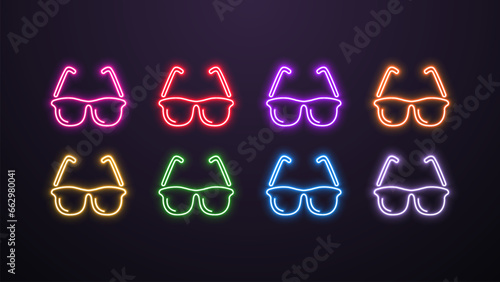 A set of neon bright luminous glasses in different colors on a dark background.