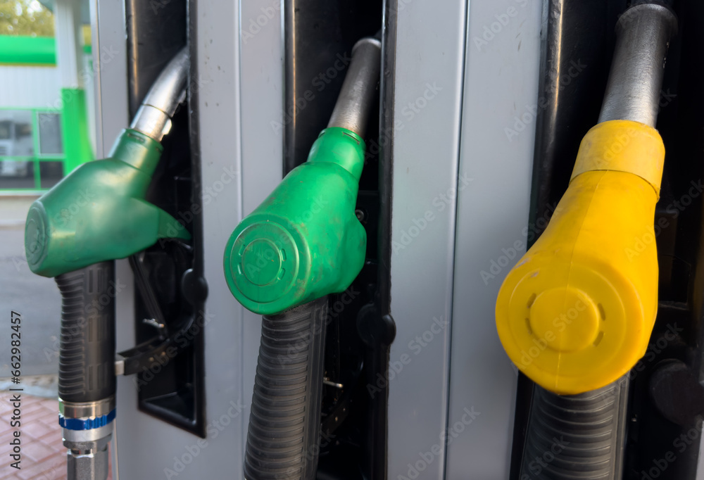 Fump dispenser at petrol station. Fuel price, diesel, gas prices for car and truck. Refueling cars at pump fuel station. Gasoline pump for refilling. Fuel station for refueling. Fump dispenser at petrol station. Fuel price, diesel, gas prices for car and truck. Refueling cars at pump fuel station. Gasoline pump for refilling. Fuel station for refueling.