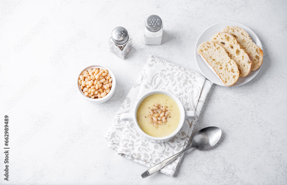 White beans rosemary potato soup in a bowl White beans rosemary potato soup in a bowl