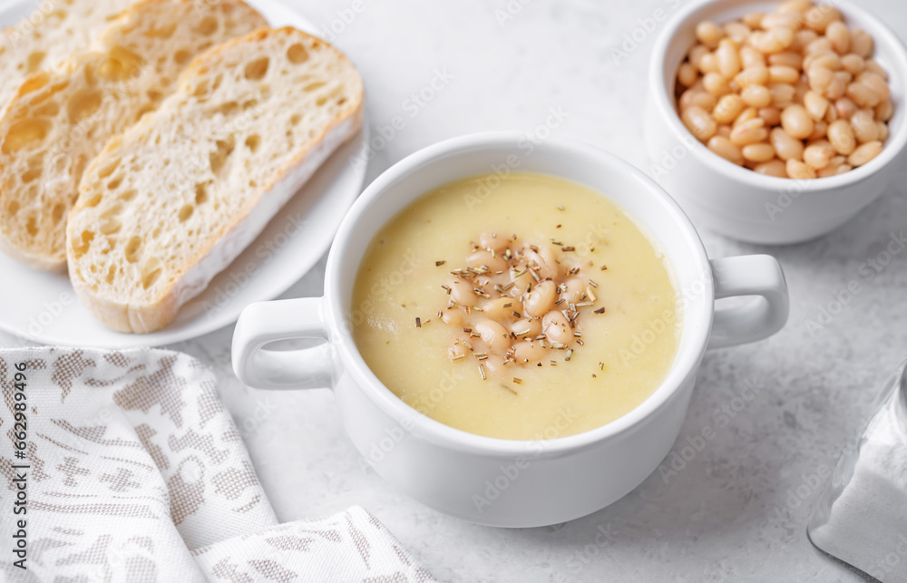 White beans rosemary potato soup in a bowl White beans rosemary potato soup in a bowl