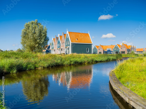 A row of houses in the Volendam, Netherlands. Old buildings. Architecture and construction. Photo for background and wallpaper.